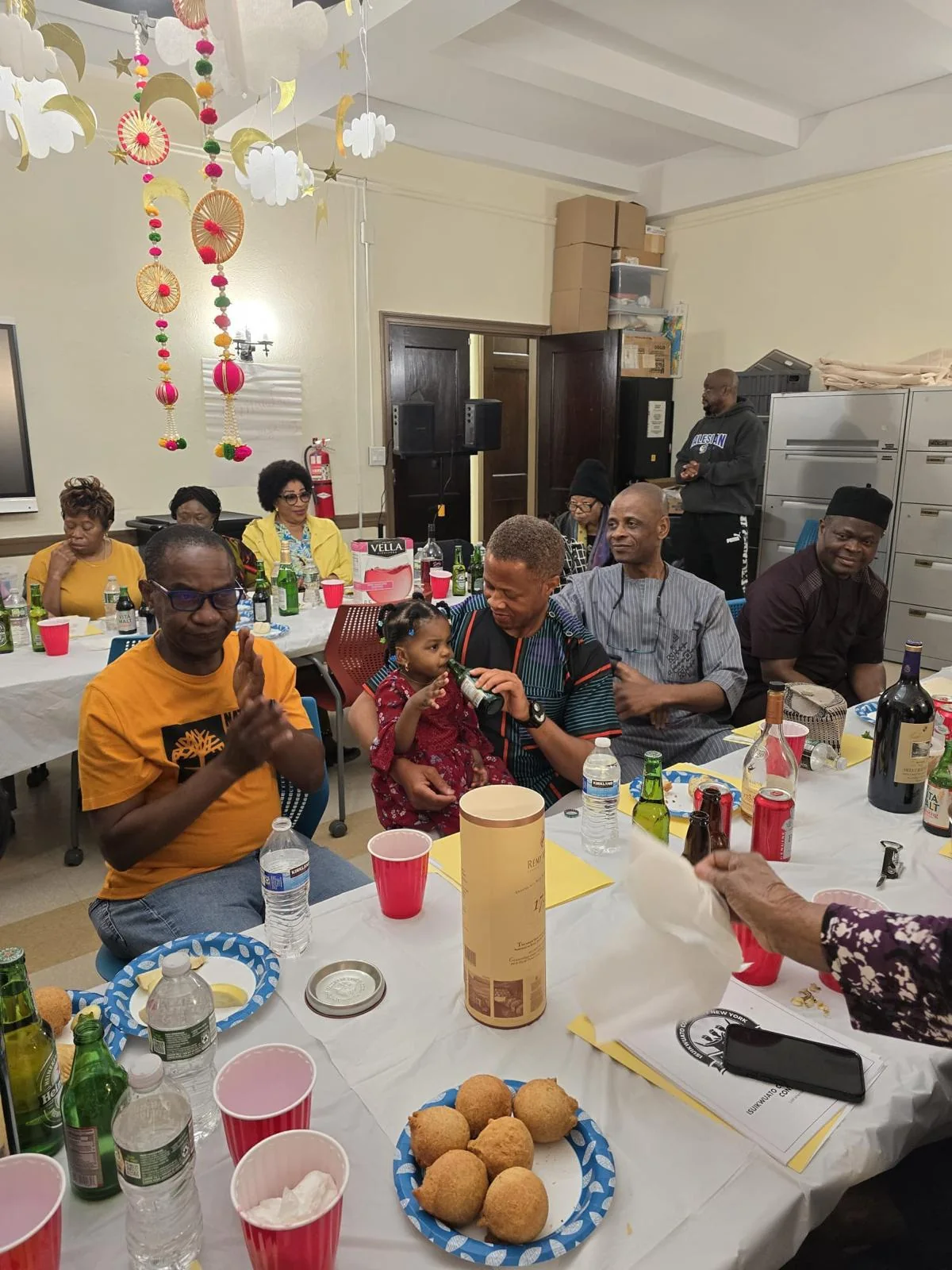 Community members sharing a meal at a gathering