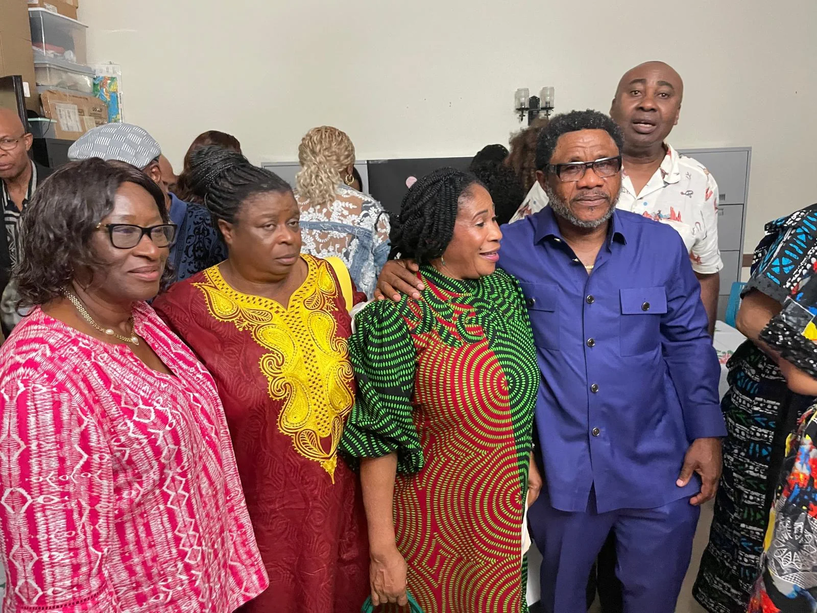 Community members talking together at a cultural event